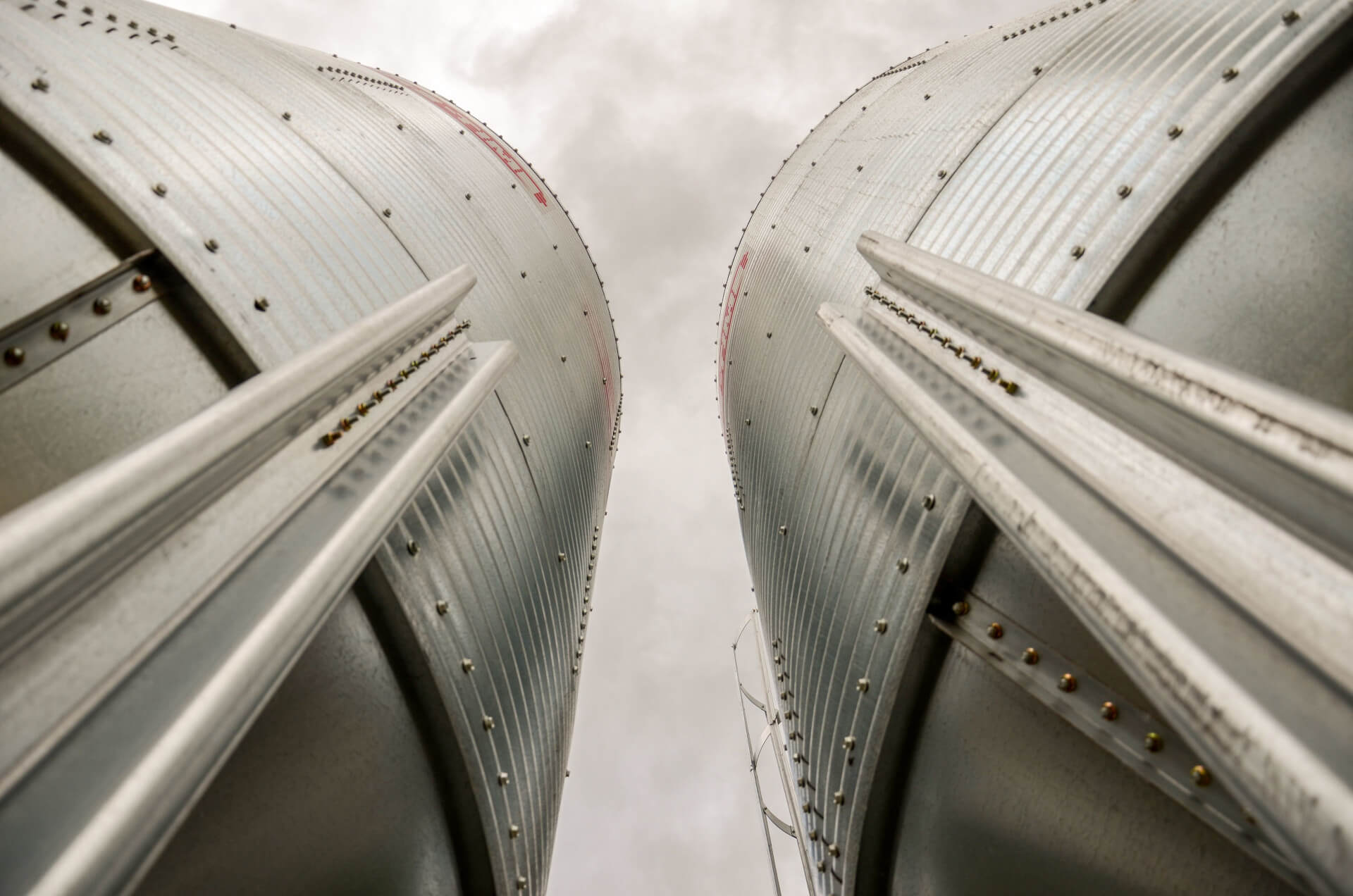 low-angle-of-the-aluminum-surface-of-grain-silos-o-2025-02-11-19-31-42-utc