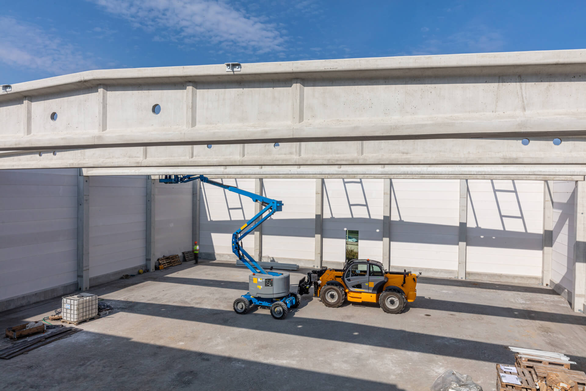 warehouse-construction-with-industrial-vehicles-2025-03-26-21-58-15-utc